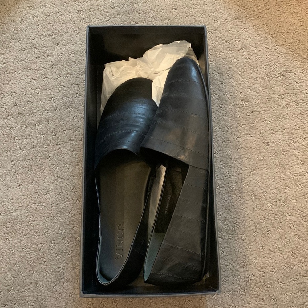 Never worn still in box Vince flats. Black leather with detailing.